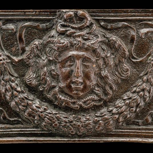 End panel of a writing casket: Medusa Head, Garland, and Bucrania