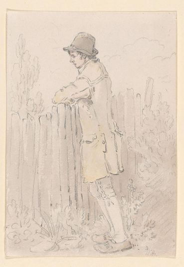 A Young Man Leaning on a Fence