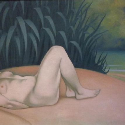 Naked woman sleeping at the edge of the water