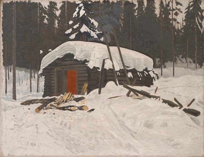 Norsk tømmerhytte med sne