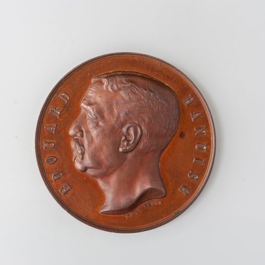 Médaille offerte à Edouard Hanuise (1867-1892), professeur de technique, par la société des anciens élèves de l'Ecole des Mines du Hainaut
