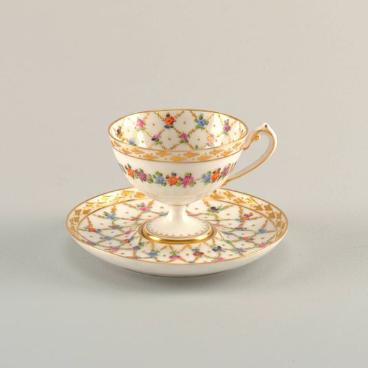 Footed Cup and Saucer with Diamond Lattice Pattern