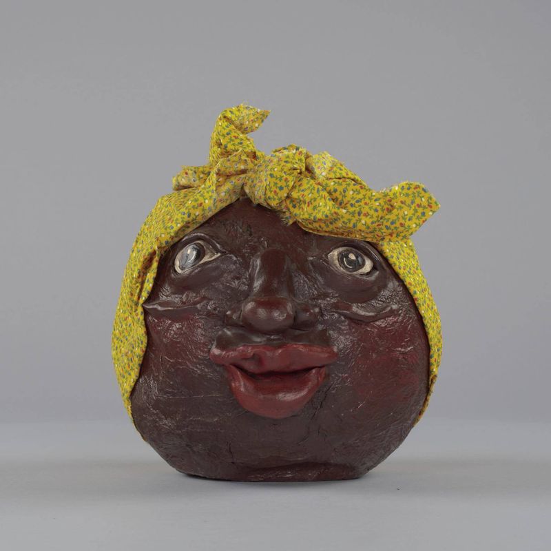 Papier mâché container in the form of "Mammy's" head