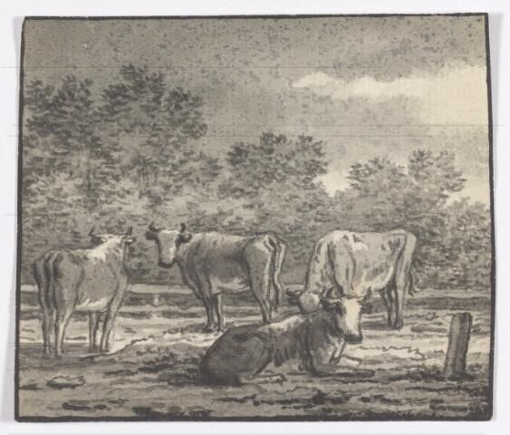 Vier koeien bij een hek