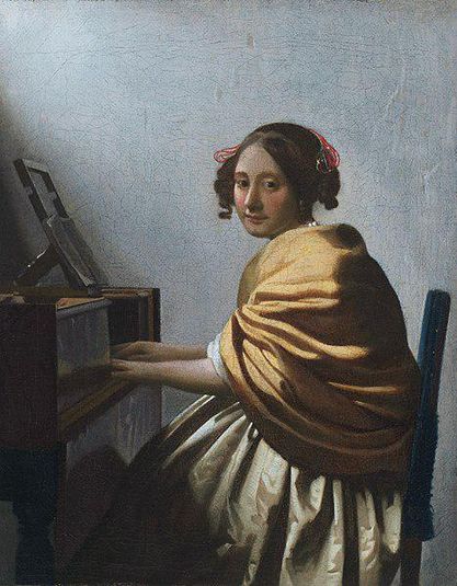 A Young Woman Seated at the Virginals