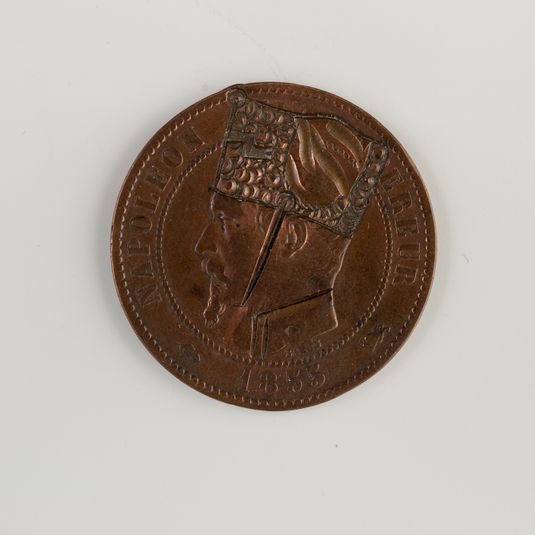 Monnaie de 1855 à l'effigie de Napoléon III (1808-1873), regravée pour en faire une satire de la bataille de Sedan, 1870