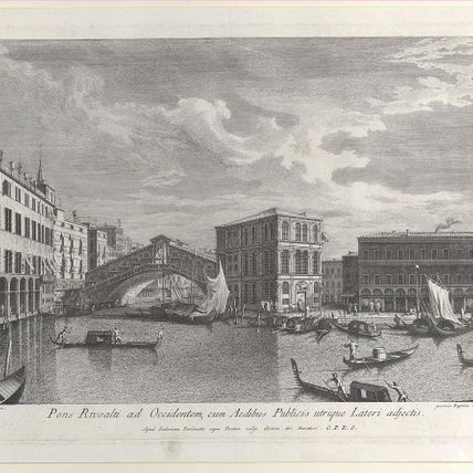 The Rialto Bridge, Venice, with boats and gondolas in the water