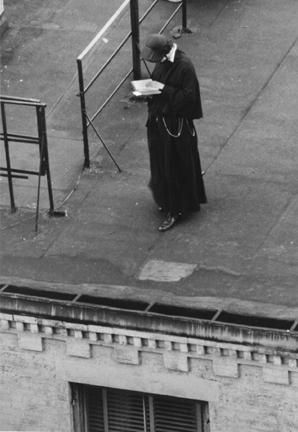 Untitled (nun reading on roof)