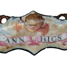 Token: Ann Higs enamel disc