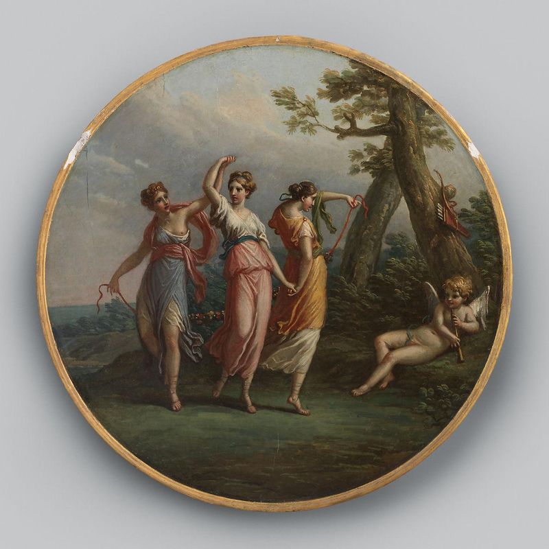 Three dancing nymphs and a reclining cupid in a landscape