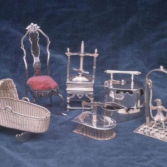 A collection of silver toys