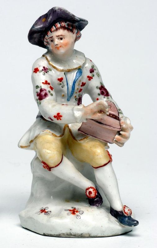 Figure of a young man playing a salt box. c1752