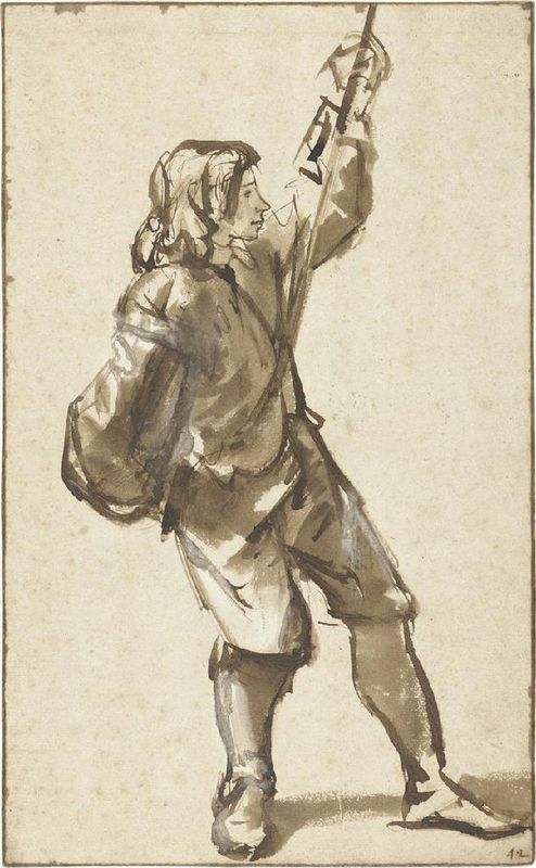 Young Man Standing Holding a Rope