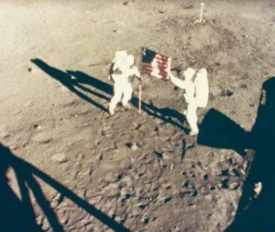 Neil Armstrong and Buzz Aldrin Deploy Flag on the Moon