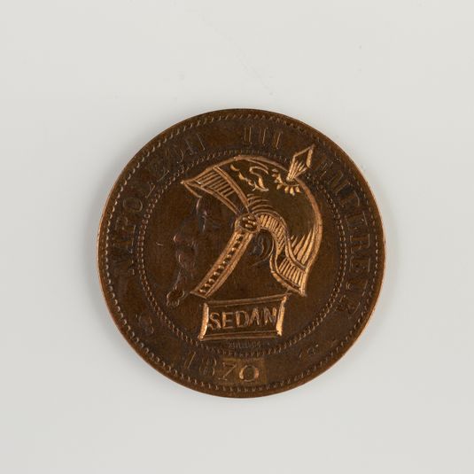 Monnaie à l'effigie de Napoléon III (1808-1873), regravée pour en faire une satire de la bataille de Sedan, 1870