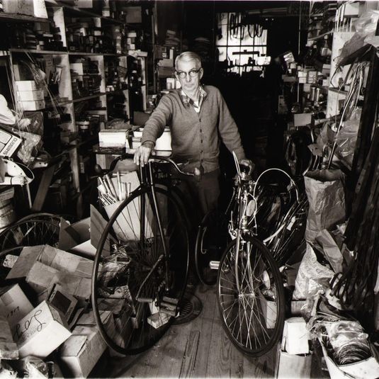 Charles Logue, an avid collector of old bikes in sports shop begun by his father in 1896