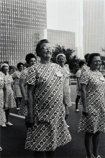 Untitled (Women in Patterned Dresses Marching)