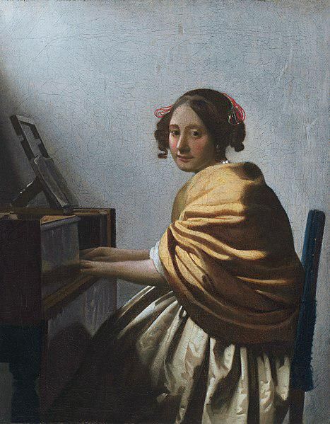 A Young Woman Seated at the Virginals