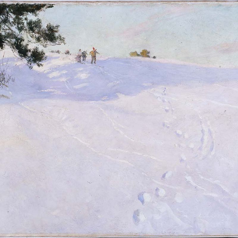 Skiers at the Top of a Snow-covered Hill