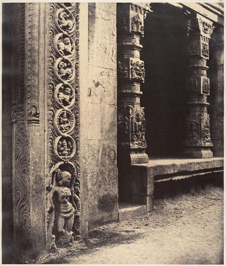Pillars in the Recessed Portico in the Roya Gopuram with the Base of One of the Four Sculptured Monoliths, Madura