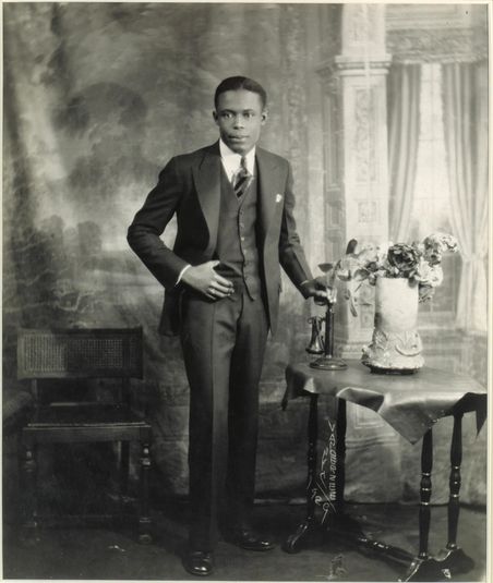 Studio Portrait of Young Man with Telephone