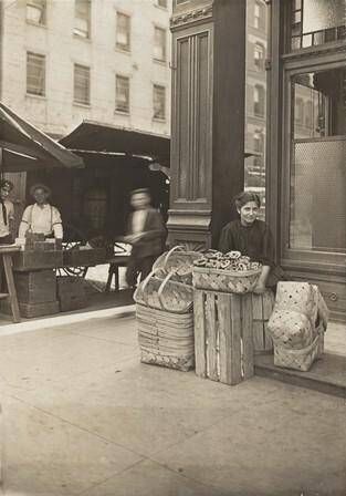 Lena Lochiavo - 11 years old, basket (and pretzel) seller, at Sixth Street Market in front of saloon entrance, Cincinnati, Ohio
