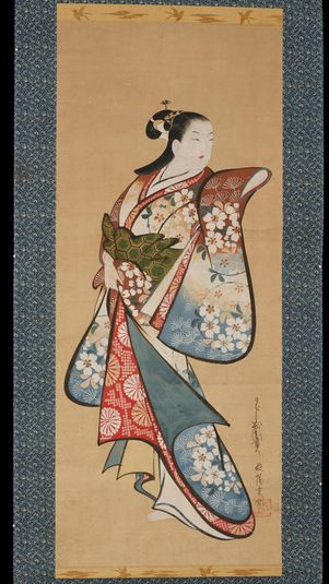 Standing prostitute wearing a kimono with plum-blossom motif