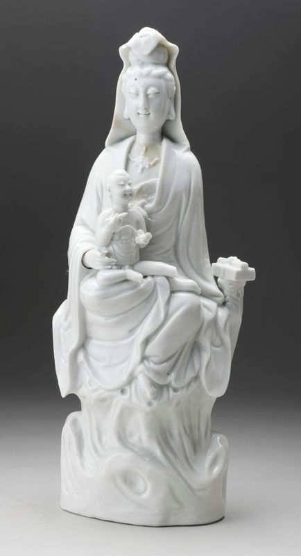 Pair of figures of Guanyin with an infant