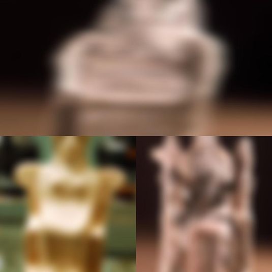 Terracotta figures of women or goddesses seated on thrones