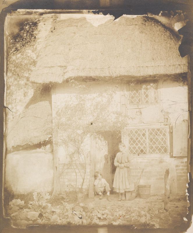 Two Children in Front of Cottage