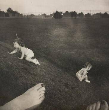 Untitled (Children crawling with bare foot in foreground)