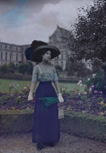 Woman with Umbrella in Garden