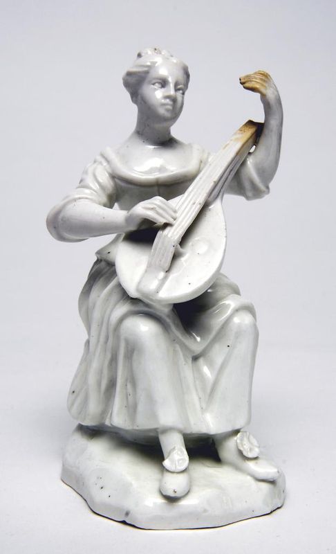 Figure: Woman playing mandolin